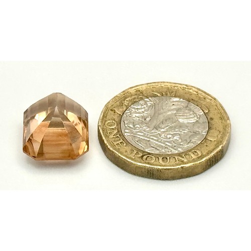 1123 - A 13.76ct Rare Imperial Topaz, Pakistan origin, in octagon step cut. Comes with GFCO certificate.