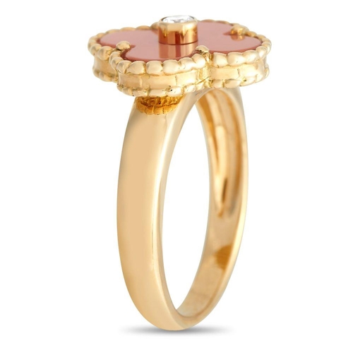 582 - A Van Cleef & Arpels Alhambra Diamond and Coral Ring. It features a yellow gold band topped with an ... 