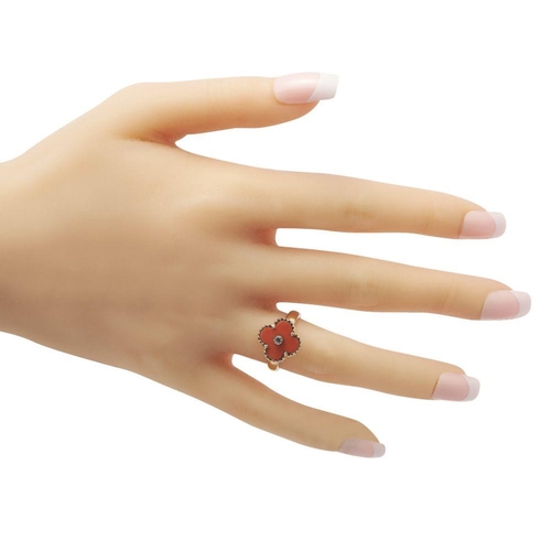 582 - A Van Cleef & Arpels Alhambra Diamond and Coral Ring. It features a yellow gold band topped with an ... 