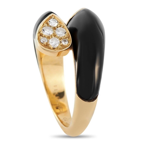 638 - A Van Cleef & Arpels 18K Yellow Gold 0.30ct Diamond and Onyx Bypass Ring. It features a bypass shank... 