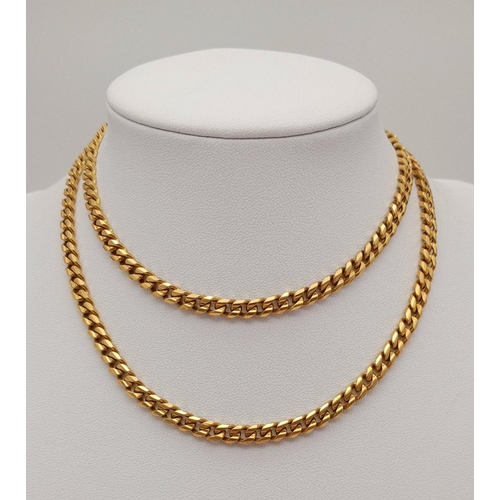 1068 - An 18K Yellow Gold Curb Link Chain. 60cm. 51.9g weight.