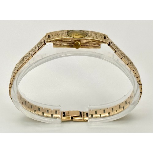 1166 - A Vintage 9k Gold Accurist Ladies Watch. 9k gold bracelet and case - 10.5mm. Patinaed dial. 17 Jewel... 