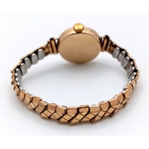 1037 - A 9K Yellow Gold Bentima Star Ladies Watch. Expandable gilded bracelet. 9K gold case - 21mm. Patinae... 