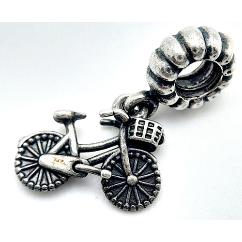 1322 - A PANDORA STERLING SILVER BICYCLE WITH A BASKET DANGLE CHARM 2.4G , 22MMX 14MM. Ref: SC 7086