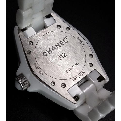 135 - A Chanel J12 White Ceramic Ladies Quartz Watch. Ceramic bracelet and case - 34mm. White dial with di... 