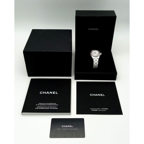 135 - A Chanel J12 White Ceramic Ladies Quartz Watch. Ceramic bracelet and case - 34mm. White dial with di... 