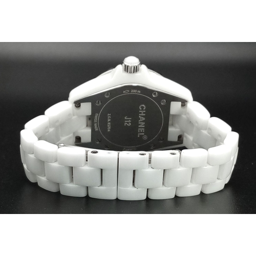 135 - A Chanel J12 White Ceramic Ladies Quartz Watch. Ceramic bracelet and case - 34mm. White dial with di... 