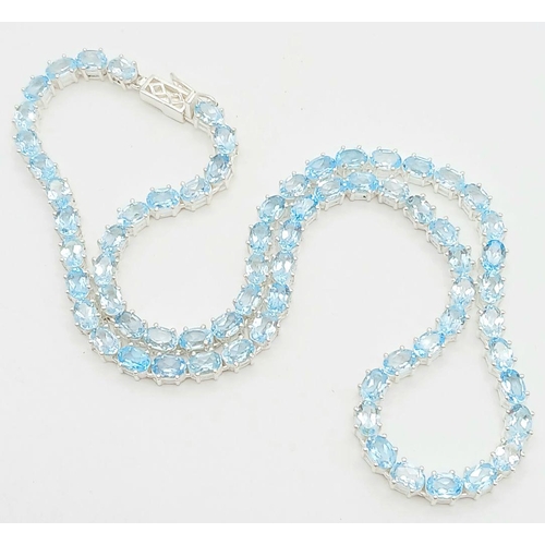 1486 - A Blue Topaz Gemstone Tennis Necklace. Set in 925 Silver. 44cm. CD-1597