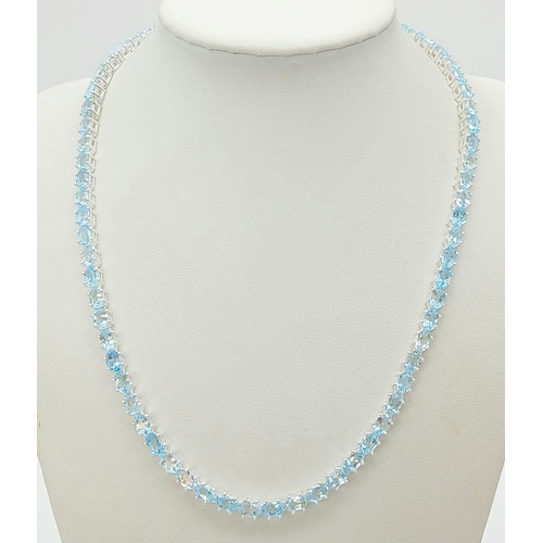 1486 - A Blue Topaz Gemstone Tennis Necklace. Set in 925 Silver. 44cm. CD-1597