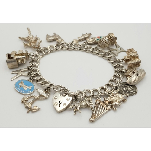 1522 - A vintage Solid Silver 925 Charm Bracelet, with 16 charms,� 45.9 grams, 18cm, Heart padlock and safe... 