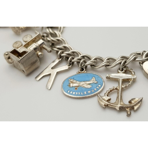 1522 - A vintage Solid Silver 925 Charm Bracelet, with 16 charms,� 45.9 grams, 18cm, Heart padlock and safe... 