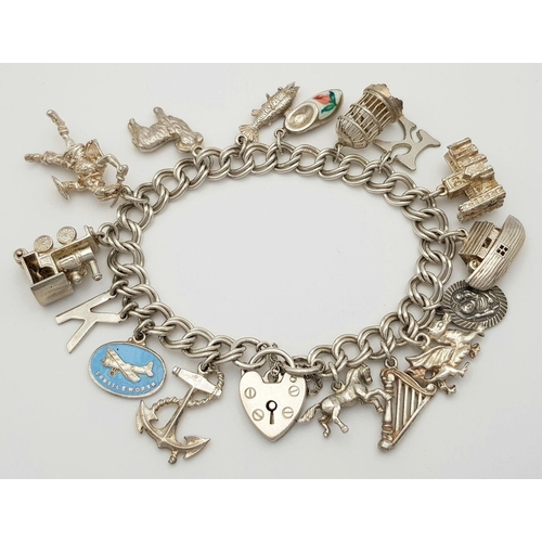 1522 - A vintage Solid Silver 925 Charm Bracelet, with 16 charms,� 45.9 grams, 18cm, Heart padlock and safe... 