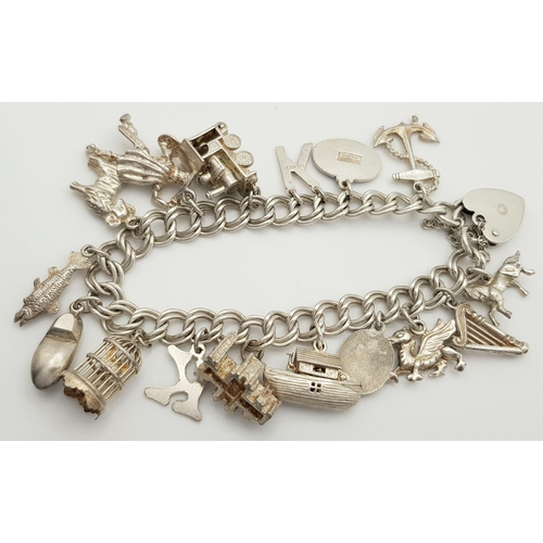 1522 - A vintage Solid Silver 925 Charm Bracelet, with 16 charms,� 45.9 grams, 18cm, Heart padlock and safe... 