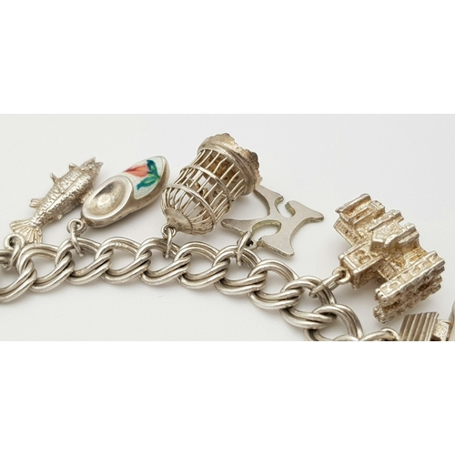 1522 - A vintage Solid Silver 925 Charm Bracelet, with 16 charms,� 45.9 grams, 18cm, Heart padlock and safe... 