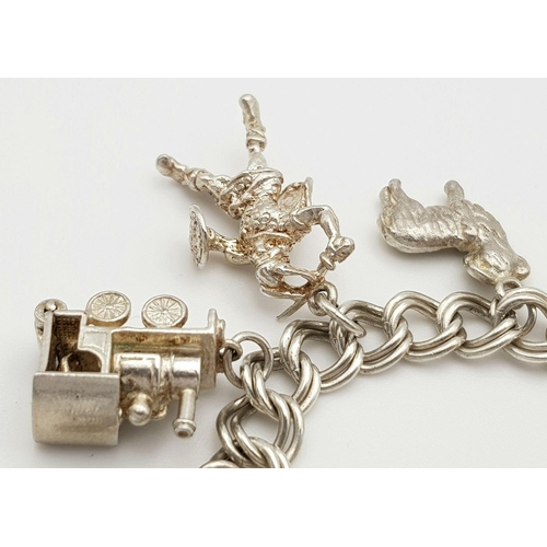 1522 - A vintage Solid Silver 925 Charm Bracelet, with 16 charms,� 45.9 grams, 18cm, Heart padlock and safe... 