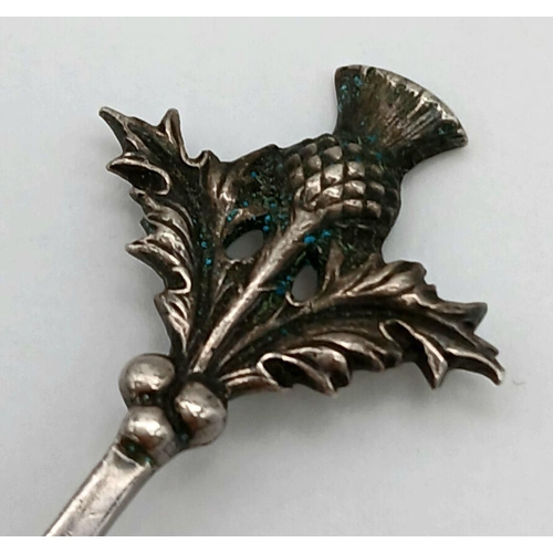 1552 - An antique sterling silver souvenir Thistle spoon with curved handle. Full Edinburgh hallmarks, 1918... 