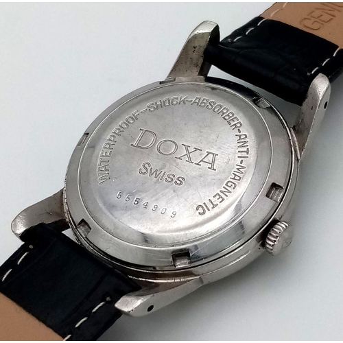 1719 - A Vintage Doxa 21 Jewels Automatic Gents Watch. Black leather strap. Stainless steel case - 34mm. Bl... 