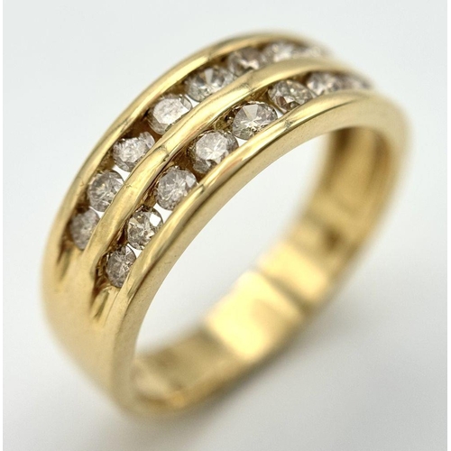 1763 - An 18K Yellow Gold Two Row Diamond Ring. 18 channel set diamonds - 0.75ctw approx. Size P 1/2. 5.2g ... 