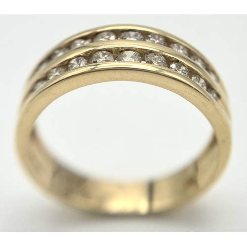 1763 - An 18K Yellow Gold Two Row Diamond Ring. 18 channel set diamonds - 0.75ctw approx. Size P 1/2. 5.2g ... 