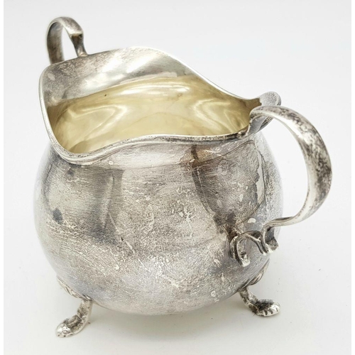 1783 - An antique sterling silver cream jug. Full Birmingham hallmarks, 1928. Total weight 111.4G. Height 7... 