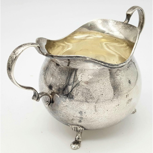 1783 - An antique sterling silver cream jug. Full Birmingham hallmarks, 1928. Total weight 111.4G. Height 7... 