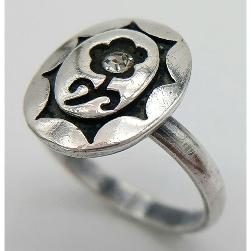 1829 - A fancy vintage 925 silver CZ flower ring. Total weight 3.9G. Size N/O.