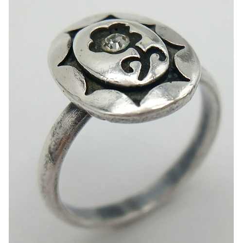 1829 - A fancy vintage 925 silver CZ flower ring. Total weight 3.9G. Size N/O.