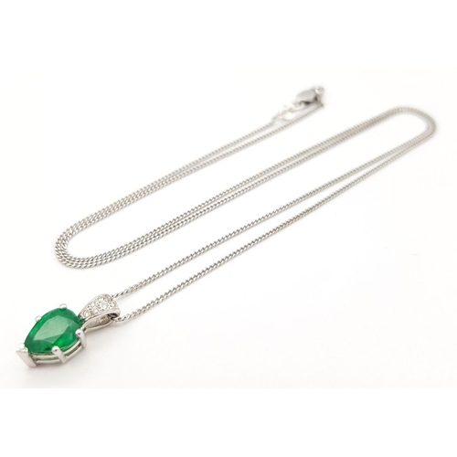 2085 - An 18K White Gold and Emerald Pendant on an 18K White Gold Disappearing Necklace. A 1ct pear shaped ... 