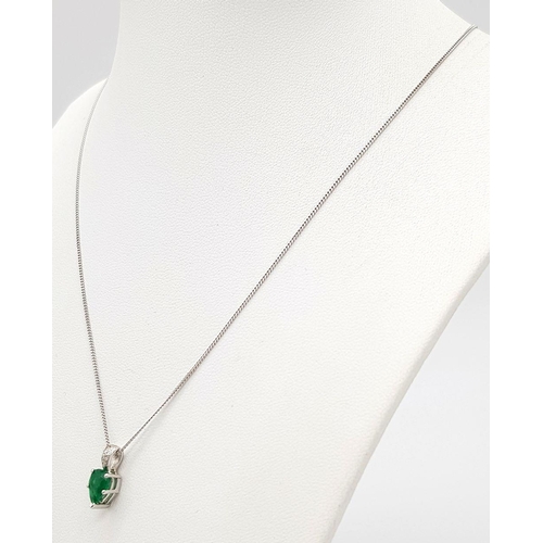 2085 - An 18K White Gold and Emerald Pendant on an 18K White Gold Disappearing Necklace. A 1ct pear shaped ... 