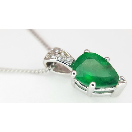 2085 - An 18K White Gold and Emerald Pendant on an 18K White Gold Disappearing Necklace. A 1ct pear shaped ... 