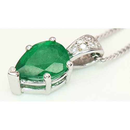 2085 - An 18K White Gold and Emerald Pendant on an 18K White Gold Disappearing Necklace. A 1ct pear shaped ... 