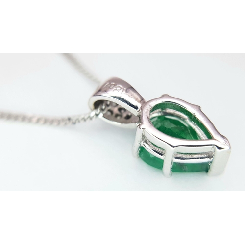 2085 - An 18K White Gold and Emerald Pendant on an 18K White Gold Disappearing Necklace. A 1ct pear shaped ... 