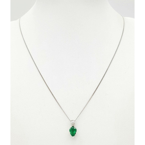 2085 - An 18K White Gold and Emerald Pendant on an 18K White Gold Disappearing Necklace. A 1ct pear shaped ... 