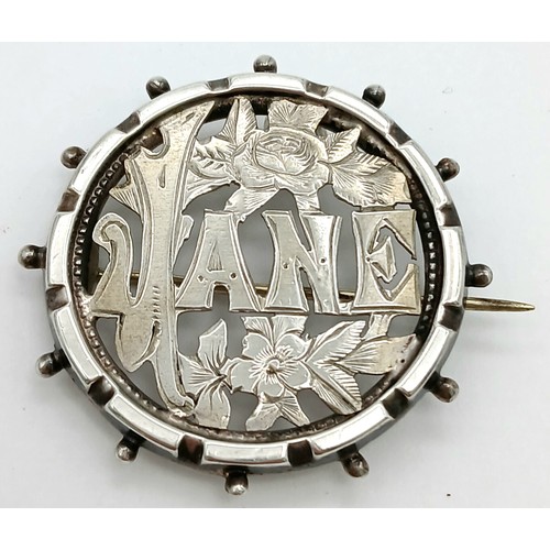 602 - Antique SILVER wartime SWEETHEART BROOCH having the name ‘JANE’ stamped out with floral decoration s... 