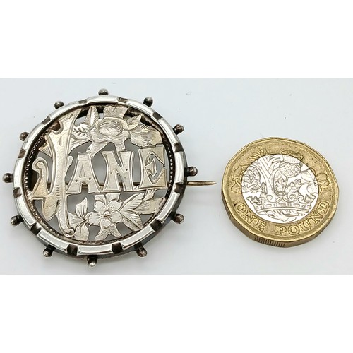 602 - Antique SILVER wartime SWEETHEART BROOCH having the name ‘JANE’ stamped out with floral decoration s... 