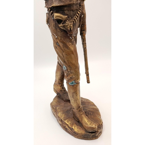 2109 - A 20th Century Figure of a Faux Bronze Cowboy Looking to the Distance. 47cm tall.