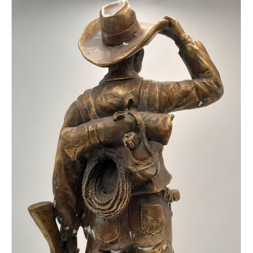 2109 - A 20th Century Figure of a Faux Bronze Cowboy Looking to the Distance. 47cm tall.