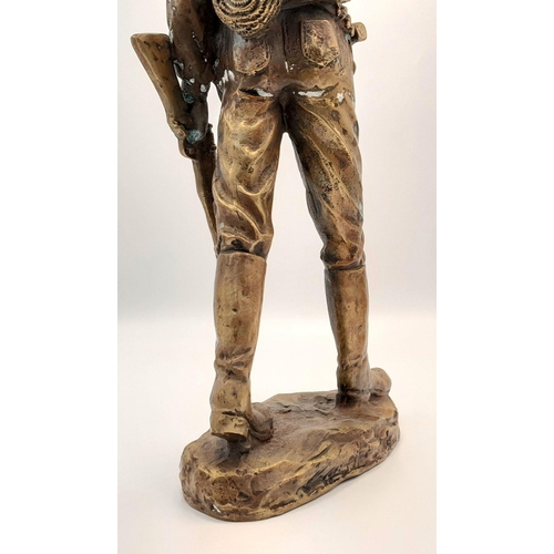 2109 - A 20th Century Figure of a Faux Bronze Cowboy Looking to the Distance. 47cm tall.