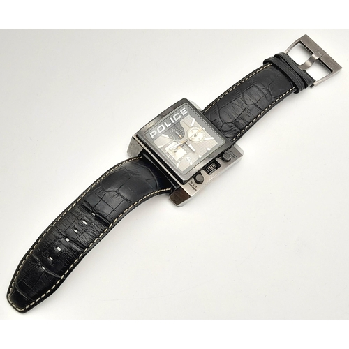 1809 - A Chunky Police Oversized Gents Watch. Black leather strap.
Case - 49mm. Metallic grey dial with thr... 