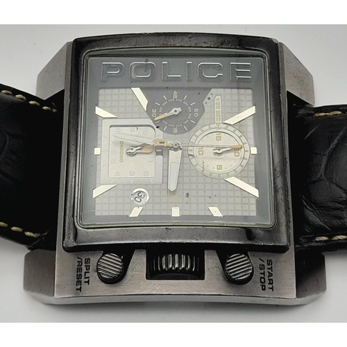 1809 - A Chunky Police Oversized Gents Watch. Black leather strap.
Case - 49mm. Metallic grey dial with thr... 