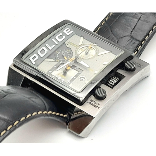 1809 - A Chunky Police Oversized Gents Watch. Black leather strap.
Case - 49mm. Metallic grey dial with thr... 