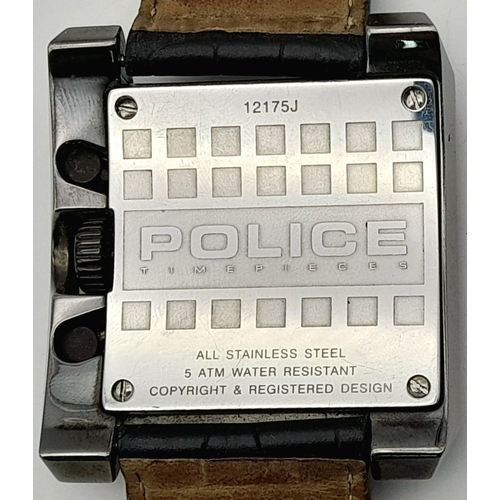 1809 - A Chunky Police Oversized Gents Watch. Black leather strap.
Case - 49mm. Metallic grey dial with thr... 