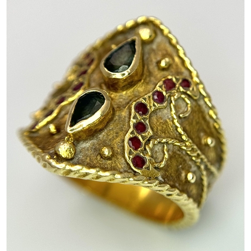 1967 - A 14k Yellow Gold Etruscan Style Emerald and Ruby Set Ring. 
Size Q. 7.8g.