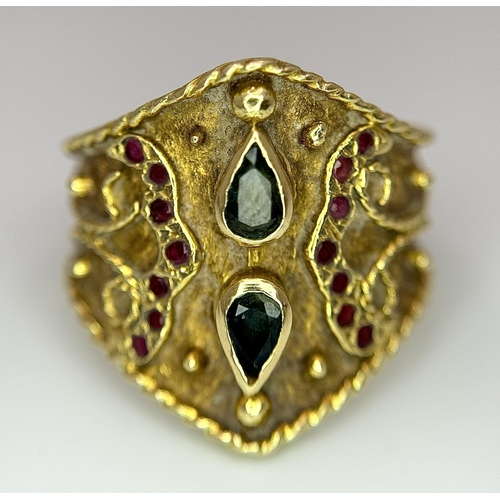 1967 - A 14k Yellow Gold Etruscan Style Emerald and Ruby Set Ring. 
Size Q. 7.8g.