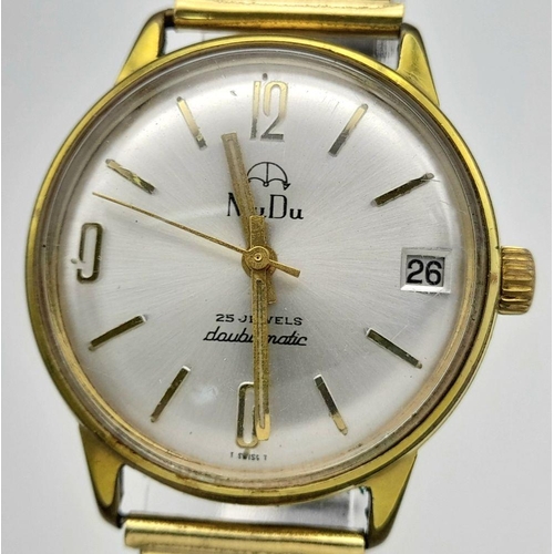 2074 - A Vintage Mudu Doublematic Gold Plated Gents Watch. Expandable bracelet. Case - 34mm. Silver tone di... 