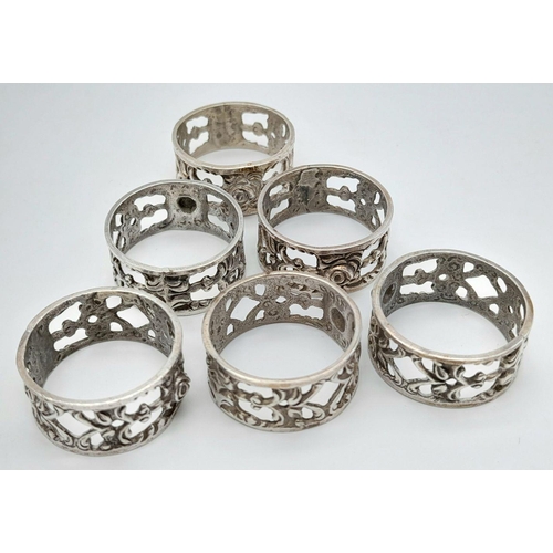 1608 - Six Identical Silver Rings. All size S. Pierced decoration. 21g. 
In a case.