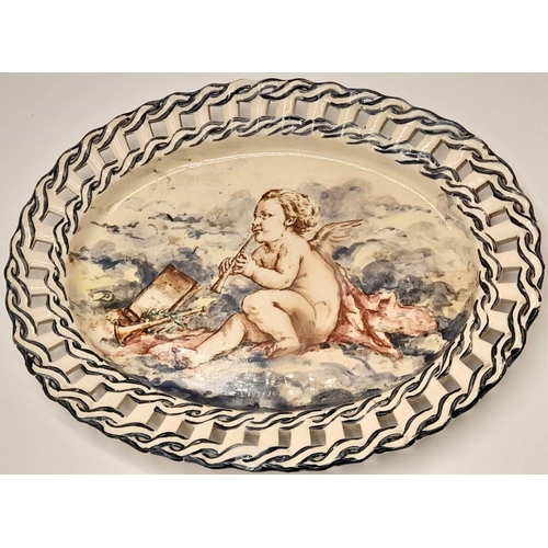 2104 - An Antique Ceramic Oval Dish with a Decorative Ribbon Style Surround. Hand-painted with a cherub 'at... 