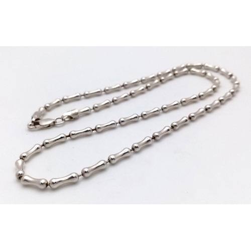 2428 - A 925 Silver Dogbone Link Necklace. 44cm. 14g