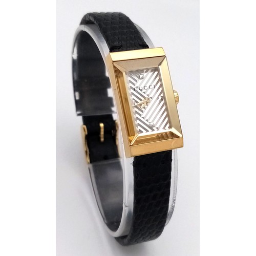 564 - A Gucci gold plated ladies quartz wristwatch with black leather strap, 14mm case diameter, in good w... 