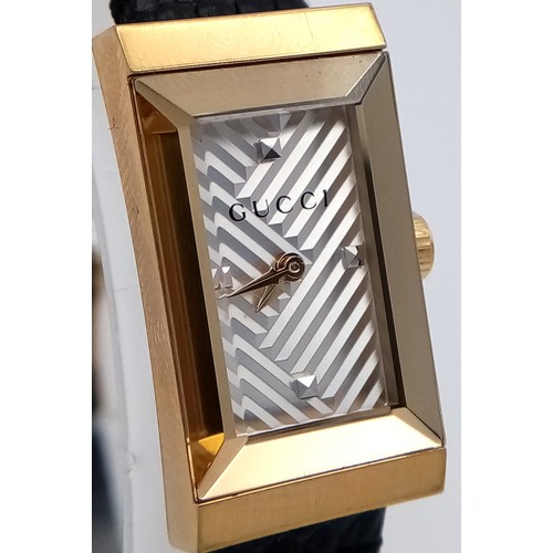 564 - A Gucci gold plated ladies quartz wristwatch with black leather strap, 14mm case diameter, in good w... 